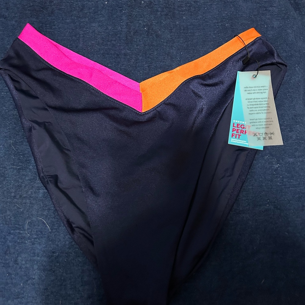 OneOne Swim navy blue, pink, and orange bikini bottoms